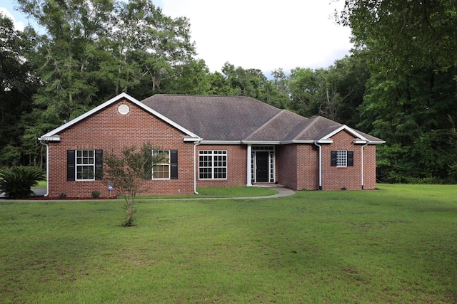 325 Mine Rd, Midway, FL 32343 - single story home featuring brick siding, a front lawn, and roof with shingles