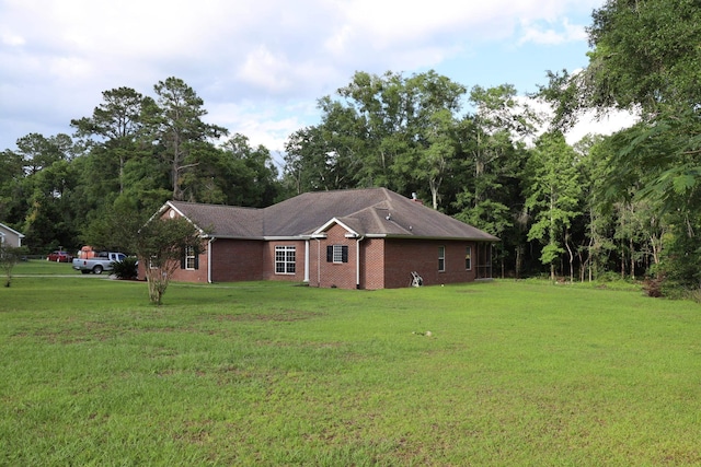 325 Mine Rd, Midway, FL 32343 - view of side of property with a yard and brick siding