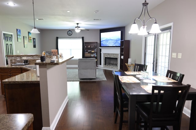 325 Mine Rd, Midway, FL 32343 - dining room with a ceiling fan, a fireplace, dark wood-type flooring, and recessed lighting