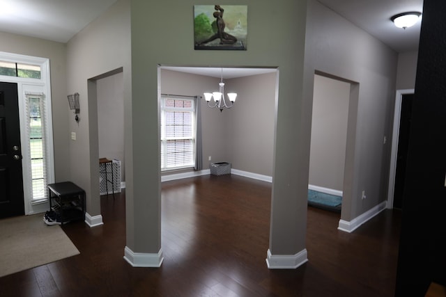 325 Mine Rd, Midway, FL 32343 - entryway featuring dark wood-style floors, a chandelier, and ornate columns