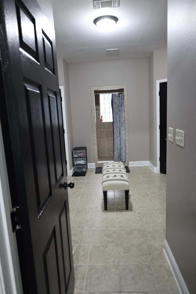 325 Mine Rd, Midway, FL 32343 - entryway with light tile patterned floors and baseboards
