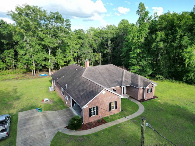 325 Mine Rd, Midway, FL 32343 - aerial view of property and surrounding area featuring a heavily wooded area