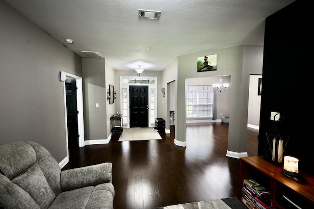 325 Mine Rd, Midway, FL 32343 - foyer featuring wood finished floors and a chandelier