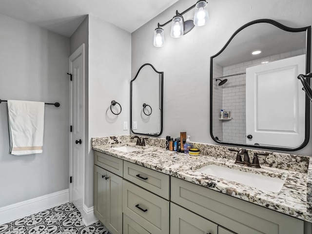 bathroom featuring tile patterned flooring and vanity