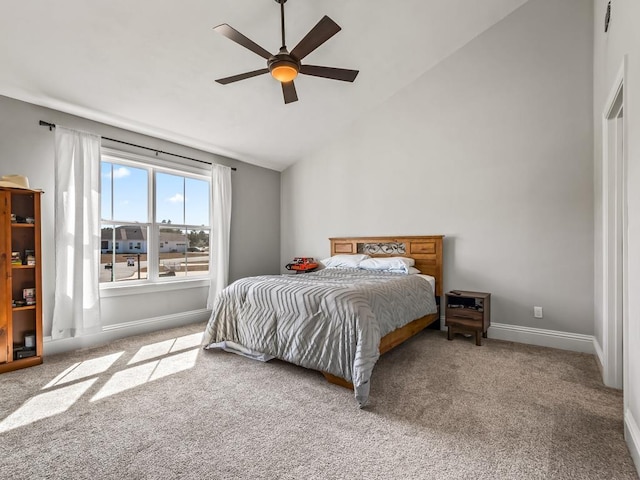 bedroom with vaulted ceiling, light carpet, and ceiling fan