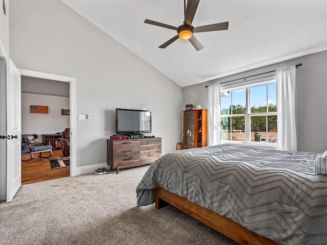 bedroom featuring high vaulted ceiling, ceiling fan, and carpet