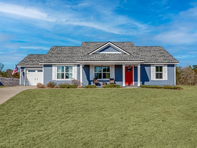 view of front of home featuring a garage, a porch, and a front yard