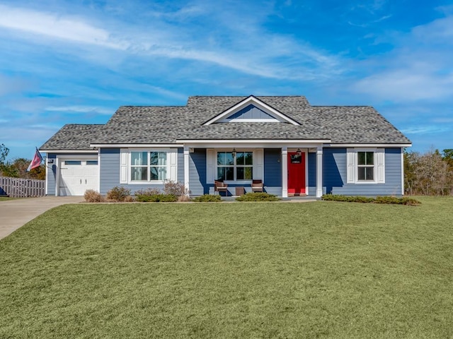 view of front of home featuring a garage, a porch, and a front yard