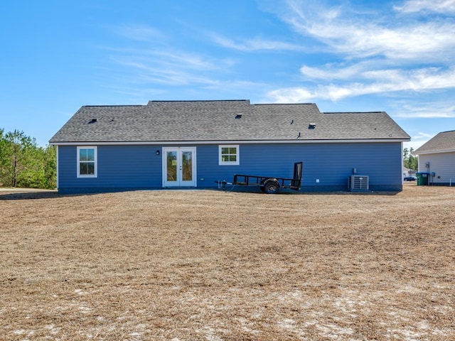 back of property featuring central AC unit and french doors