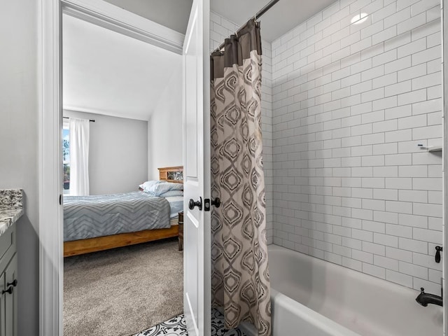 bathroom with shower / tub combo with curtain, vanity, and vaulted ceiling