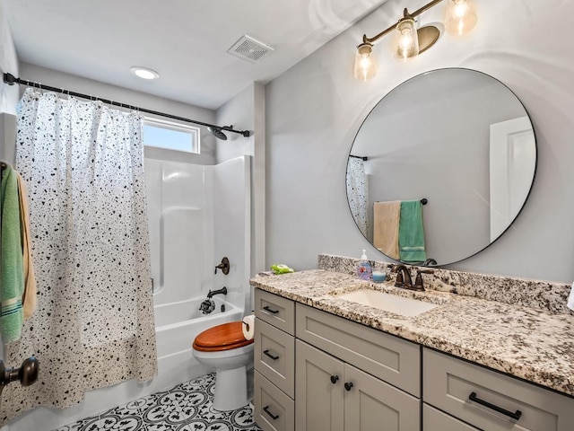 full bathroom with vanity, shower / bath combination with curtain, and toilet