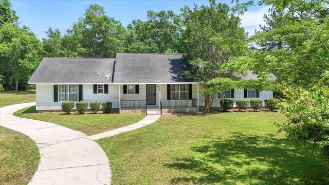 4545 Thomasville Rd, Tallahassee, FL 32309 - view of front facade with a porch and a front lawn
