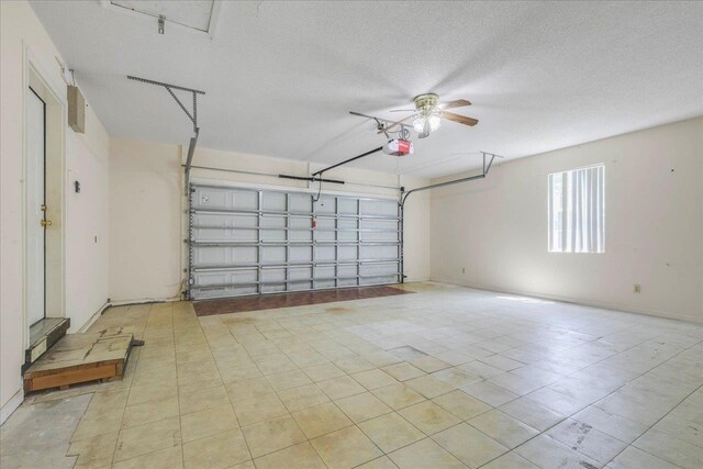 4545 Thomasville Rd, Tallahassee, FL 32309 - garage featuring a garage door opener and ceiling fan