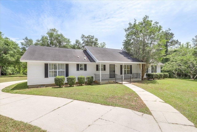 4545 Thomasville Rd, Tallahassee, FL 32309 - ranch-style house featuring a porch and a front yard
