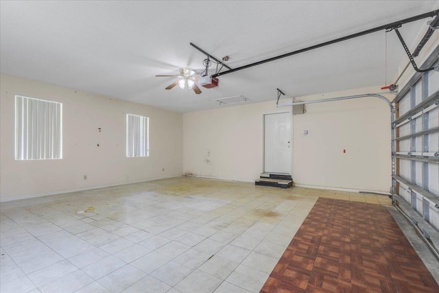 4545 Thomasville Rd, Tallahassee, FL 32309 - garage with a garage door opener and ceiling fan