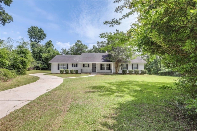 4545 Thomasville Rd, Tallahassee, FL 32309 - ranch-style house featuring a porch, a front yard, and concrete driveway