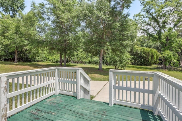 4545 Thomasville Rd, Tallahassee, FL 32309 - deck featuring a lawn and view of wooded area
