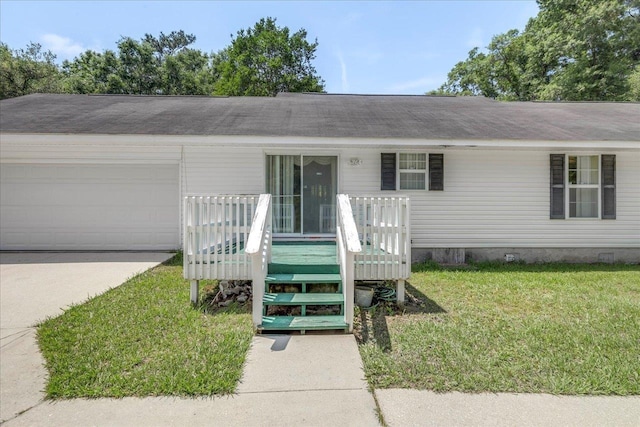 4545 Thomasville Rd, Tallahassee, FL 32309 - view of front of property featuring a front lawn, driveway, an attached garage, and a wooden deck