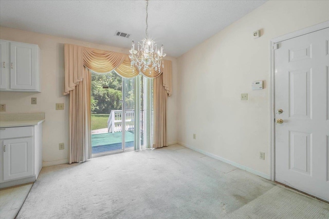 4545 Thomasville Rd, Tallahassee, FL 32309 - unfurnished dining area featuring a chandelier, light colored carpet, and baseboards