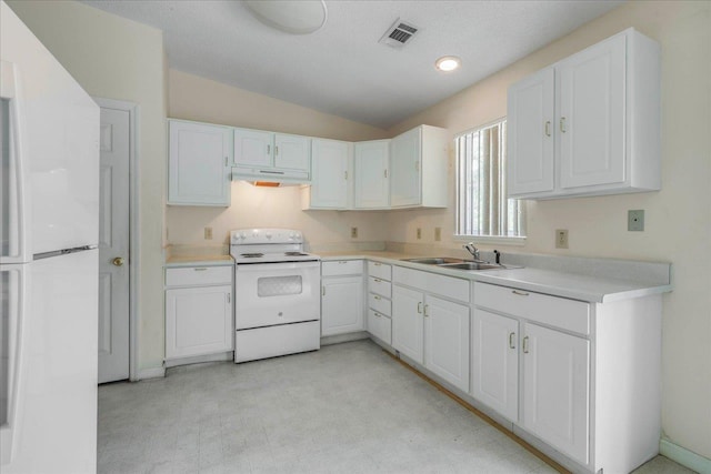 4545 Thomasville Rd, Tallahassee, FL 32309 - kitchen with white range with electric cooktop, a sink, under cabinet range hood, white cabinets, and lofted ceiling