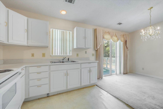 4545 Thomasville Rd, Tallahassee, FL 32309 - kitchen featuring a sink, a chandelier, white cabinets, electric range, and light colored carpet