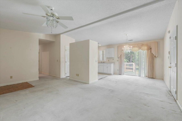 4545 Thomasville Rd, Tallahassee, FL 32309 - unfurnished living room with a chandelier, light carpet, ceiling fan, baseboards, and a textured ceiling
