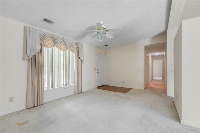 4545 Thomasville Rd, Tallahassee, FL 32309 - carpeted spare room featuring ceiling fan, a textured ceiling, and baseboards