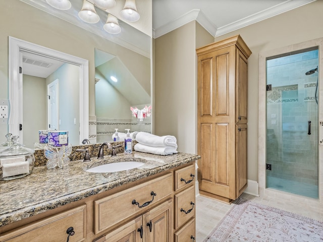 bathroom featuring walk in shower, vanity, and ornamental molding