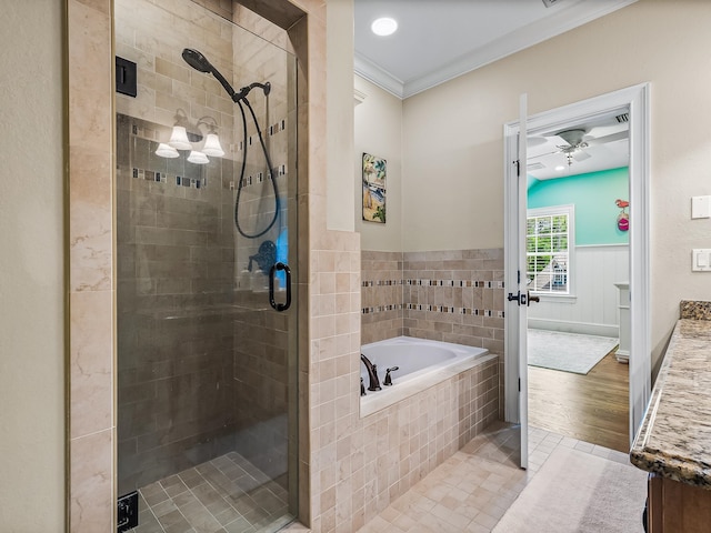 bathroom with crown molding, vanity, shower with separate bathtub, hardwood / wood-style flooring, and ceiling fan