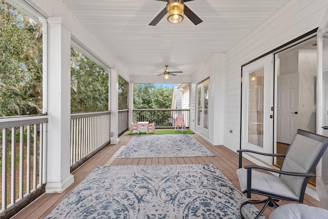 wooden deck with ceiling fan