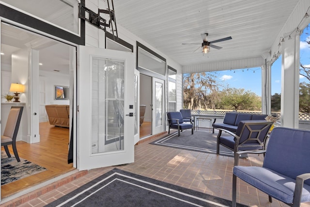 exterior space featuring an outdoor hangout area and ceiling fan