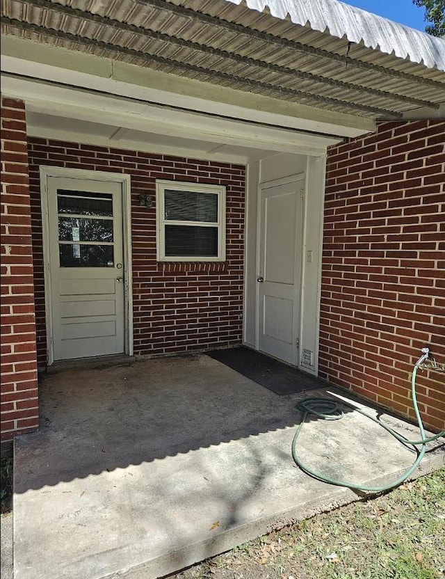 527/529 E 7th Ave -, Unit Tallahassee, FL 32303 - doorway to property featuring brick siding and a metal roof