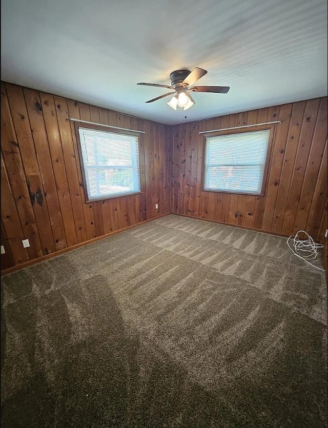 527/529 E 7th Ave -, Unit Tallahassee, FL 32303 - carpeted empty room with plenty of natural light, ceiling fan, and wood walls