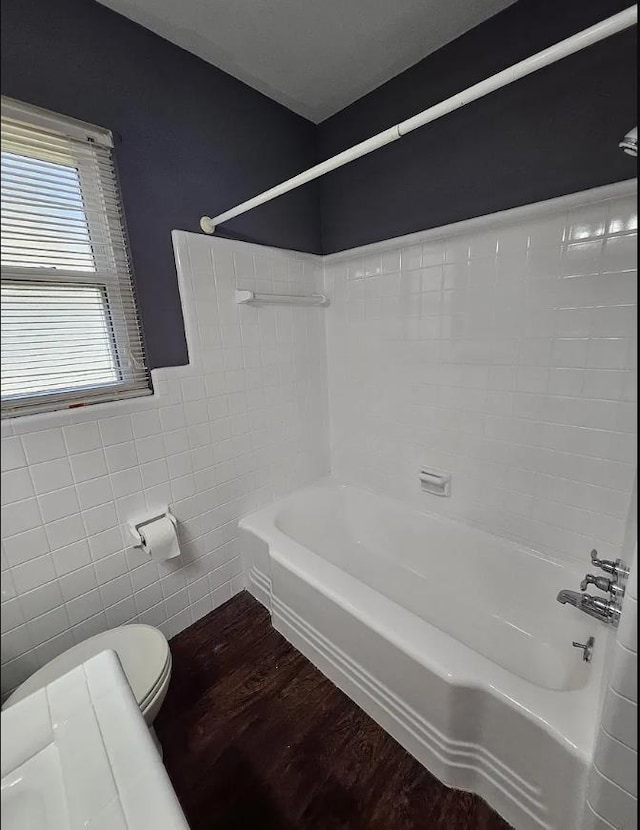 527/529 E 7th Ave -, Unit Tallahassee, FL 32303 - bathroom featuring tile walls, wood finished floors, and bathtub / shower combination