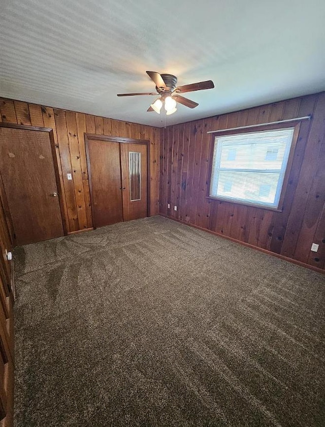 527/529 E 7th Ave -, Unit Tallahassee, FL 32303 - unfurnished bedroom with carpet floors, wooden walls, and ceiling fan