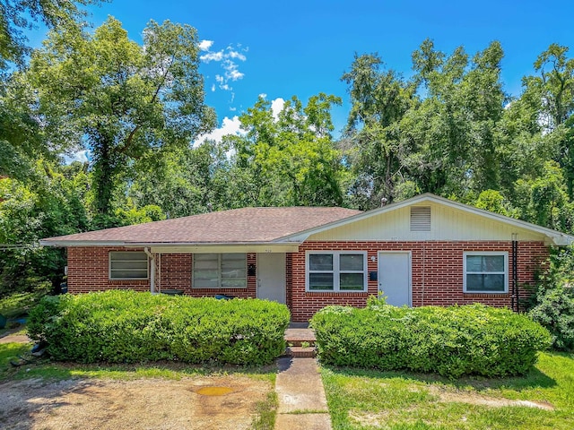 527/529 E 7th Ave -, Unit Tallahassee, FL 32303 - view of front of house with brick siding and a shingled roof