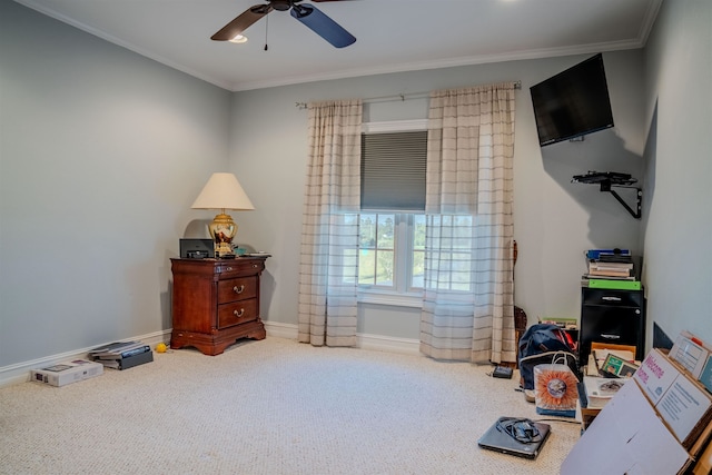 interior space with ornamental molding and ceiling fan