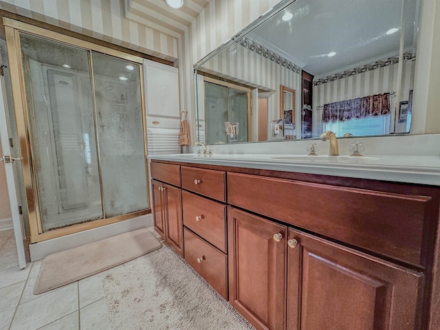 bathroom with walk in shower, tile patterned flooring, and vanity