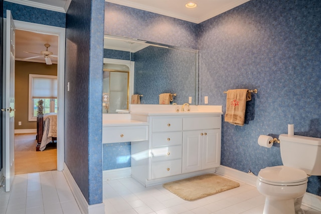 bathroom featuring tile patterned flooring, vanity, toilet, and crown molding