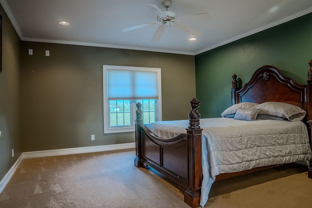 carpeted bedroom with ceiling fan and ornamental molding