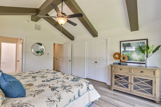 bedroom with high vaulted ceiling, beamed ceiling, ceiling fan, and light wood-type flooring