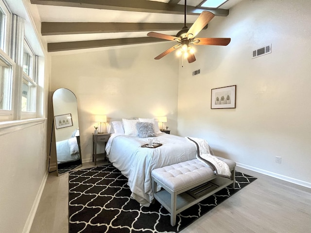 bedroom with high vaulted ceiling, ceiling fan, hardwood / wood-style flooring, and beamed ceiling