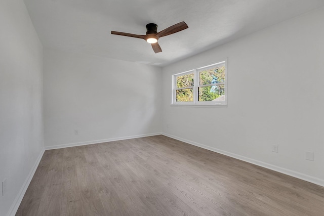 spare room with ceiling fan and light hardwood / wood-style flooring