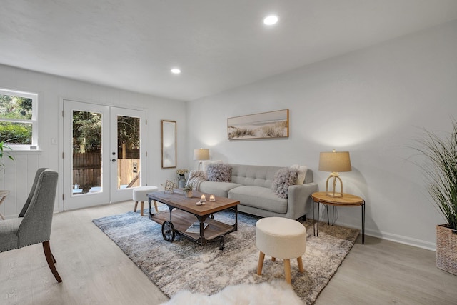 living room featuring light hardwood / wood-style flooring and french doors