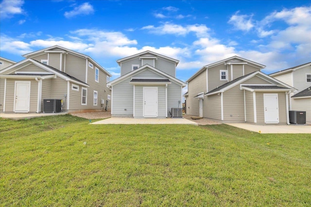 back of house with a lawn, central AC, and a patio