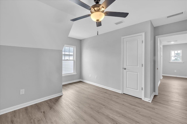 bonus room with visible vents, baseboards, and wood finished floors