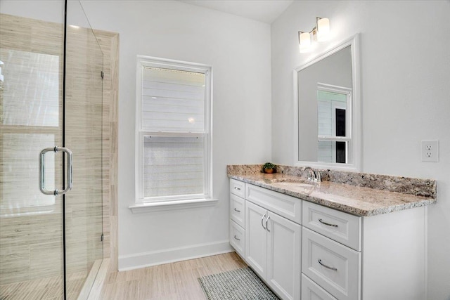 5756 Bascom Ln, Tallahassee, FL 32309 - bathroom featuring vanity, a stall shower, and baseboards