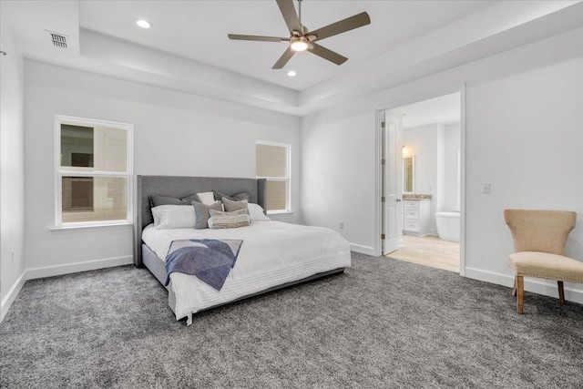 5756 Bascom Ln, Tallahassee, FL 32309 - carpeted bedroom with a tray ceiling, baseboards, recessed lighting, ensuite bathroom, and ceiling fan