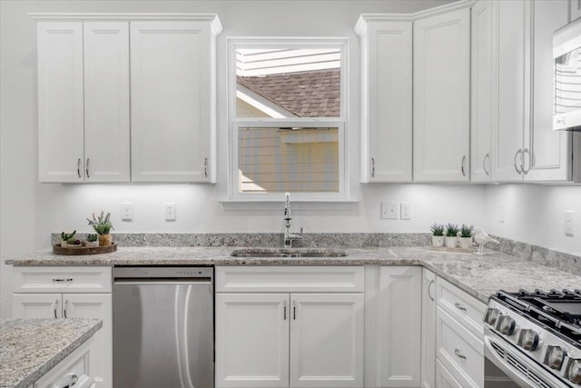 5756 Bascom Ln, Tallahassee, FL 32309 - kitchen with stainless steel dishwasher, a sink, white cabinetry, and light stone countertops