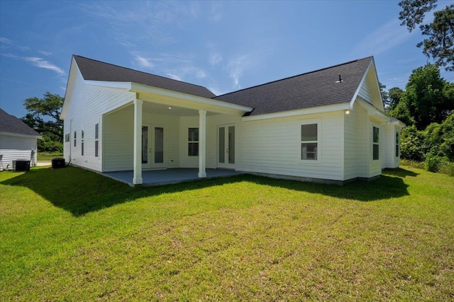 5756 Bascom Ln, Tallahassee, FL 32309 - back of house with french doors, central AC, a yard, and a patio area